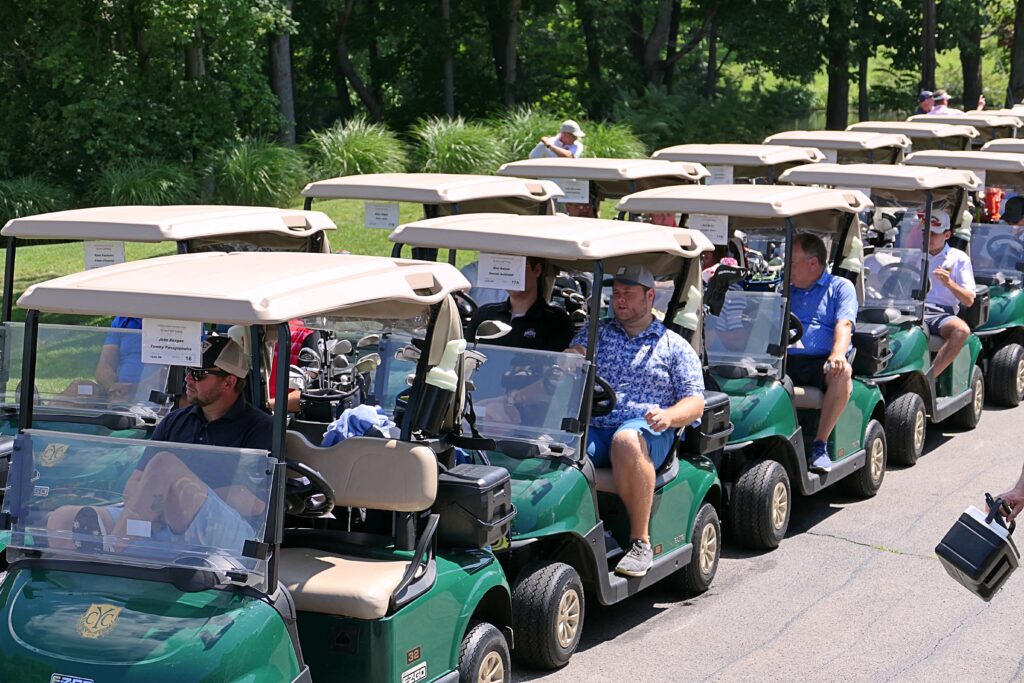 St Joseph the Provider School golf outing- participants driving in golf carts